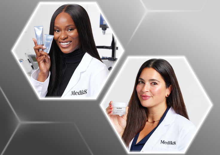 Two female skincare professionals wearing white Medik8 lab coats, each framed inside separate glowing white hexagon shapes against a textured grey background. The professional in the top left hexagon has long dark hair and holds up two silver Medik8 tubes, while the professional in the bottom right hexagon has long brunette hair and holds a clear Medik8 skincare jar.