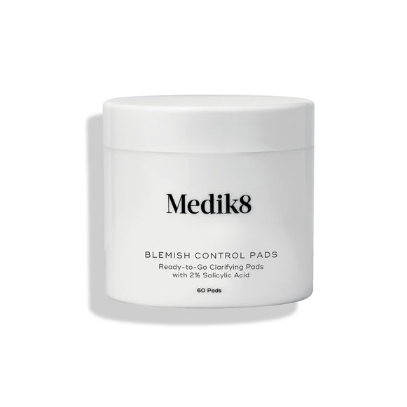 Medik8 Blemish Control Pads jar stands against a clean white background. Text identifies the product as  Ready-to-Go Clarifying Pads with 2% Salicylic Acid  containing 60 pads.-15
