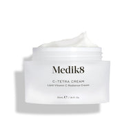 Medik8 C-Tetra Cream jar displayed open against a clean white background with soft shadows. The white, frosted-glass jar features the Medik8 logo and is labeled  C-TETRA CREAM Lipid Vitamin C Radiance Cream  in a 50mL size. A thick swirl of white cream is visible on top of the jar, highlighting its moisturising texture.