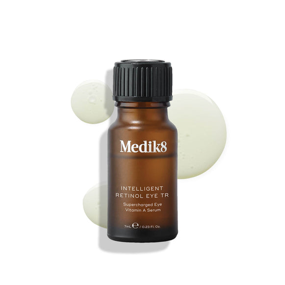 A bottle of Medik8 Intelligent Retinol Eye TR serum with a black cap on a plain background.-42