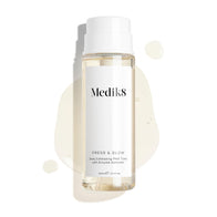 Medik8 Press & Glow tonic bottle stands against a clean white background with translucent liquid droplets and a puddle, highlighting its watery texture. Text identifies the product as a 200mL  Daily Exfoliating PHA Tonic with Enzyme Activator. 