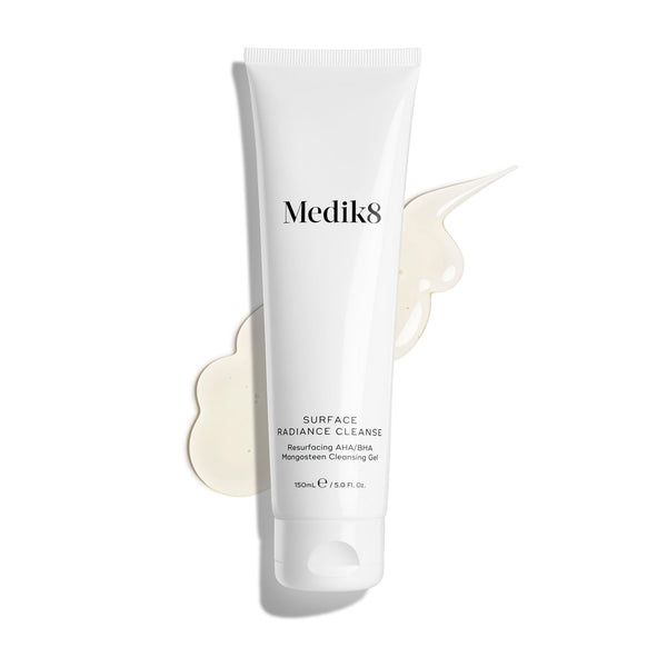 Medik8 Surface Radiance Cleanse tube displayed on a clean white background with a large, translucent gel texture smear. Text identifies it as a Resurfacing AHA/BHA Mangosteen Cleansing Gel in a 150mL size.