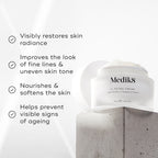 "Medik8 C-Tetra Cream jar displayed on a grey stone block against a white background with soft light rays. The image features four check-marked claims:

Visibly restores skin radiance

Improves the look of fine lines & uneven skin tone

Nourishes & softens the skin

Helps prevent visible signs of ageing"