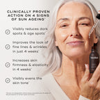 "Close-up of a person's face being treated with a glass pipette, set against a light grey background. Text states the product is  CLINICALLY PROVEN ACTION ON 4 SIGNS OF SUN AGEING*  followed by four check-marked claims:

Visibly reduces dark spots & age spots*

Improves the look of fine lines & wrinkles in just 4 weeks*

Increases skin firmness & elasticity in 4 weeks*

Visibly evens the skin tone*

A footer note specifies these results are proven via an independent clinical study conducted over 12 weeks on