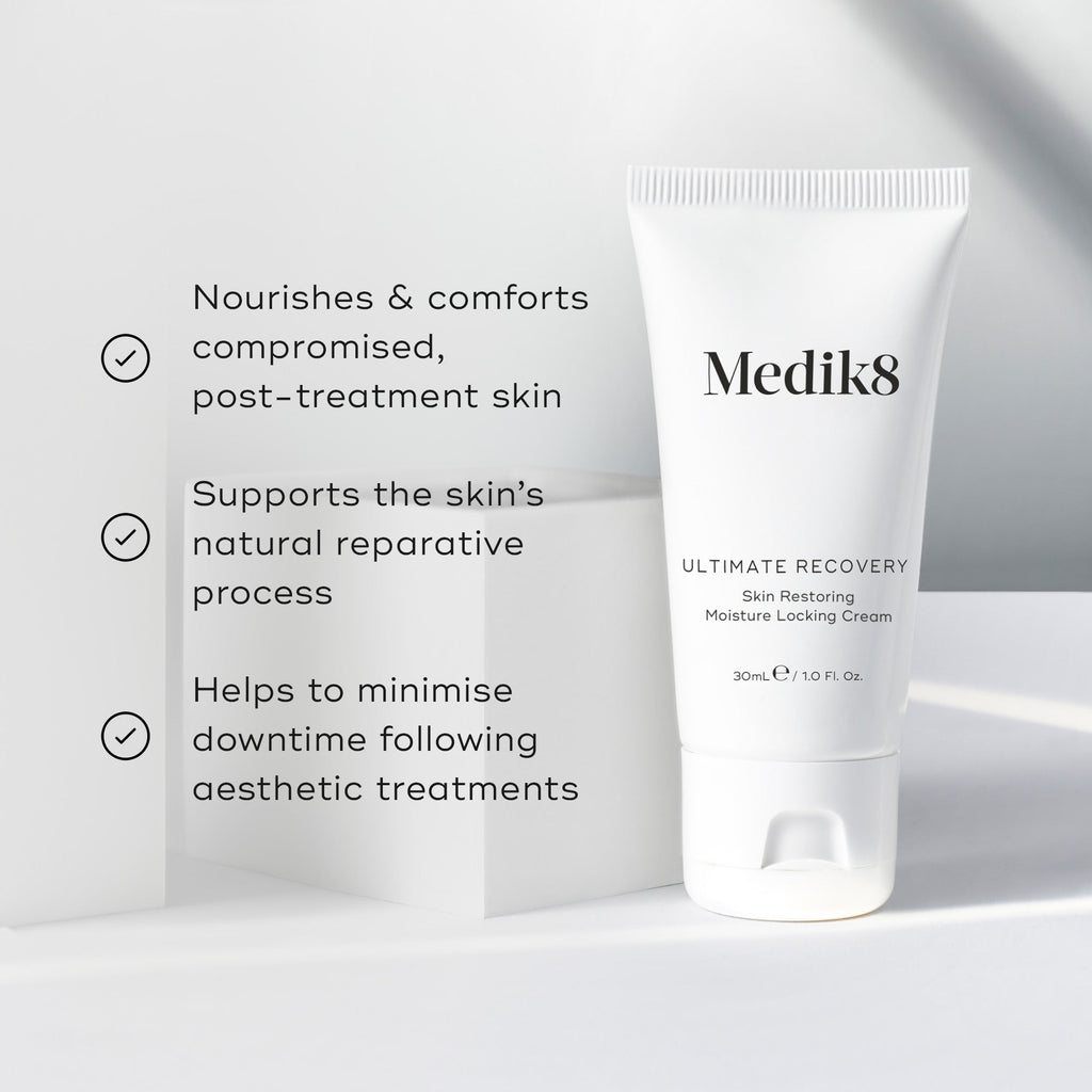 Medik8 Ultimate Recovery Skin Restoring Moisture Locking Cream tube sits against a clean white architectural background. Text claims the product nourishes compromised post-treatment skin, supports the natural reparative process, and minimizes downtime following aesthetic treatments.