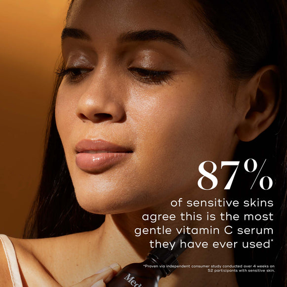 Close-up of a woman with a glowing, radiant complexion resting her hand on her cheek. Text states: "87% of sensitive skins agree this is the most gentle vitamin C serum they have ever used." Smaller text below notes results based on a consumer study.-hover-12