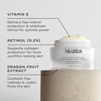 Close-up of Intelligent Retinol Smoothing Night Cream, showing a white jar with cream and labels pointing to ingredients. The background is a light, textured surface. Text boxes highlight VITAMIN E, RETINOL (0.2%) and DRAGON FRUIT EXTRACT.