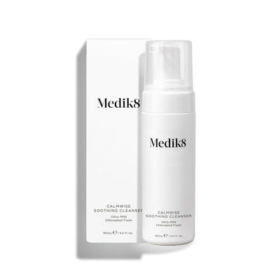 Medik8 Calmwise Soothing Cleanser pump bottle standing next to its white packaging box on a white background. Text identifies it as an  Ultra-Mild Chlorophyll Foam. 