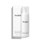 Medik8 Micellar Mousse pump bottle standing next to its white packaging box on a white background. Text identifies it as a Purifying & Nourishing Effortless Rinse-Off Cleanser. 