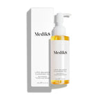 Medik8 Lipid-Balance Cleansing Oil bottle stands next to its white packaging carton. Text highlights the  Anti-Pollution Transforming Cleanser  formula and 140mL size.