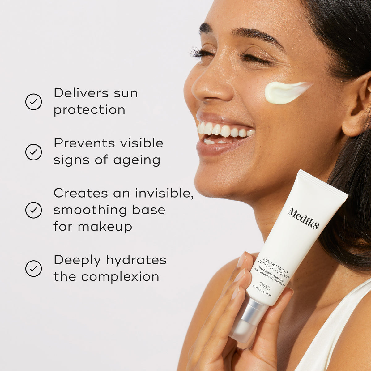 A model holding the Medik8 Advanced Day Total Protect tube next to a list of benefits with checkmark icons. Text highlights that it delivers powerful SPF 30 protection against UVA and UVB rays, prevents visible signs of ageing, creates an invisible smoothing base for makeup, and deeply hydrates the complexion.