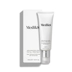 Medik8 Advanced Day Total Protect tube stands on a clean white background with a matching white outer carton. Text identifies the product as a 50mL Age-Defying Moisturiser with SPF 30 and 5* UVA protection.