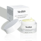 Medik8 Daily Radiance Vitamin C cream jar is shown open with a generous peak of pale yellow cream on top and it's carton packaging on the side. Text identifies the product as a 50mL C-Tetra Cream Two-in-One Moisturiser.