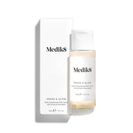 Medik8 Press & Glow tonic bottle stands in front of its matching white product carton on a clean white background. Text on both identifies the product as a travel sized Daily Exfoliating PHA Tonic with Enzyme Activator. 