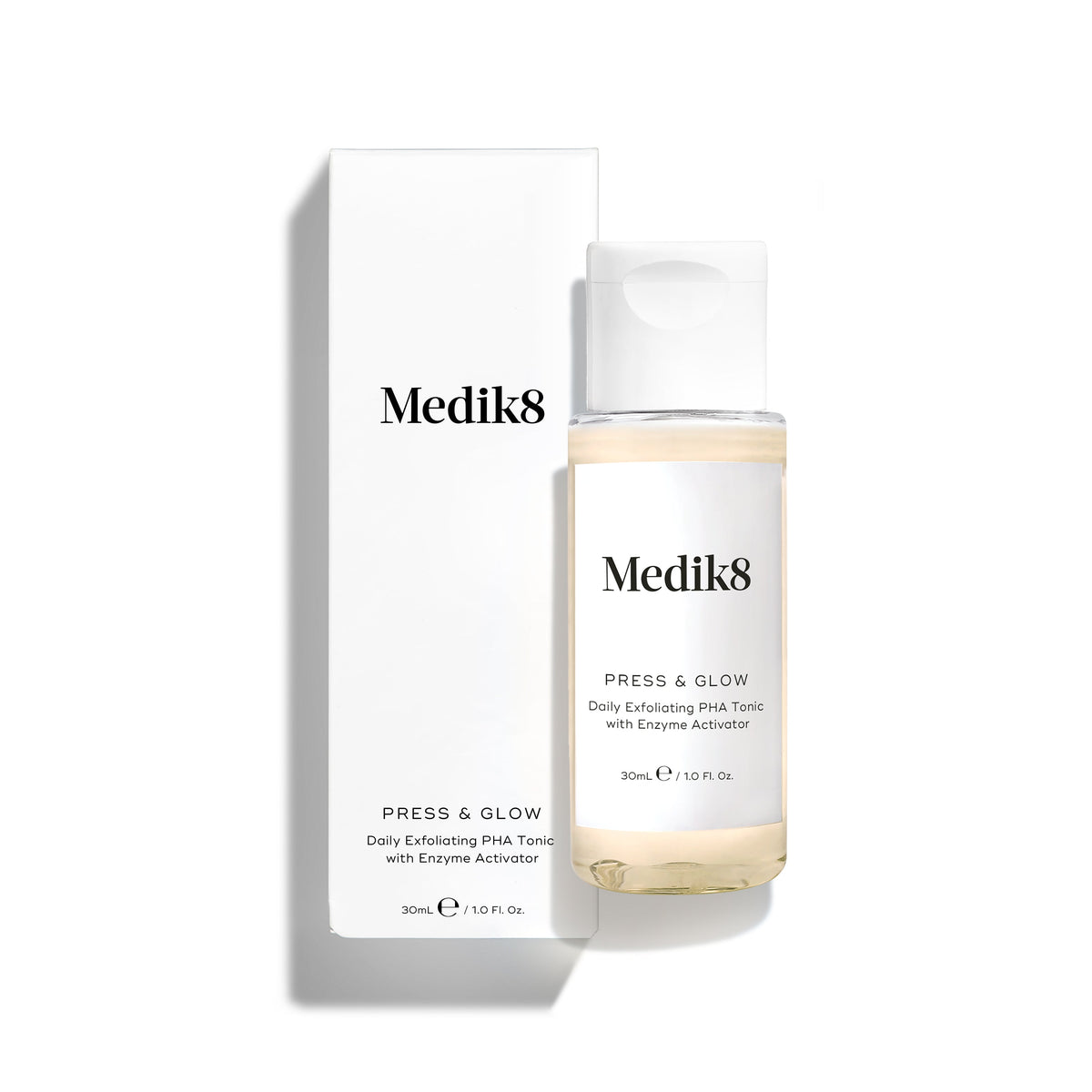 Medik8 Press & Glow tonic bottle stands in front of its matching white product carton on a clean white background. Text on both identifies the product as a travel sized Daily Exfoliating PHA Tonic with Enzyme Activator. 