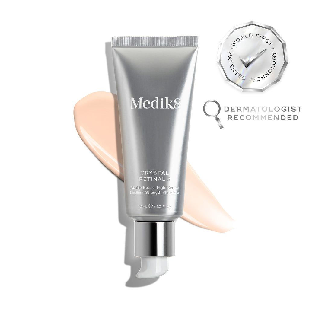 A silver tube of Crystal Retinal 3 is displayed, with a pink swatch. A WORLD FIRST PATENTED TECHNOLOGY seal and a DERMATOLOGIST RECOMMENDED icon are shown. 