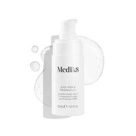 A white pump bottle of Medik8 EXO-PDRN Prismatic+ Youthful Vitality Serum rests on a white background, surrounded by a clear, glossy smear of the serum texture.