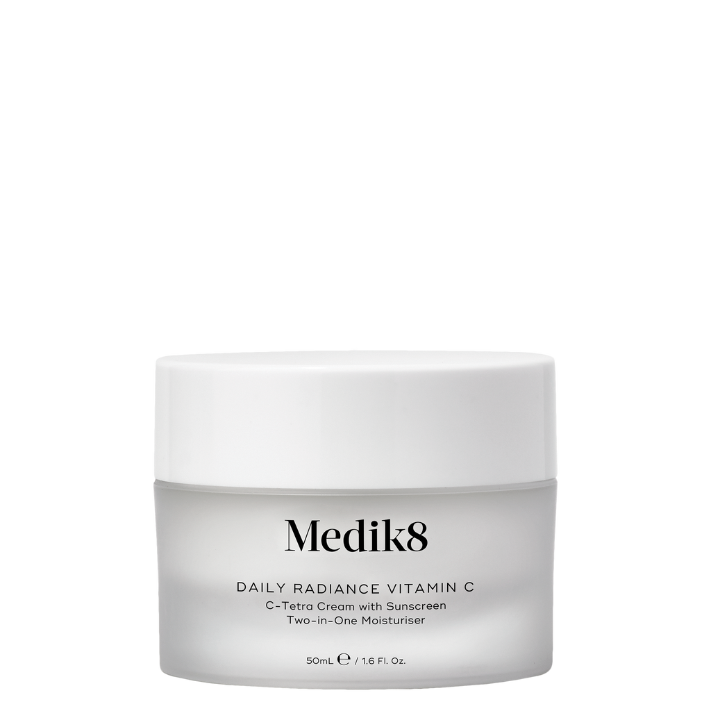 a jar of travel sized radiance vitamine c cream displayed in front of carton product texture shown