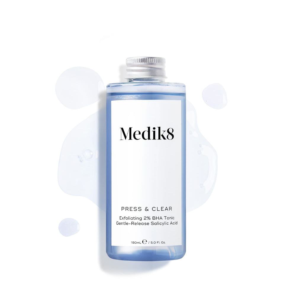 A refill bottle (150ml) of Medik8 Press & Clear tonic with a silver screw cap, displayed on a white background with blue liquid droplets. Text confirms it contains  Gentle-Release Salicylic Acid. 